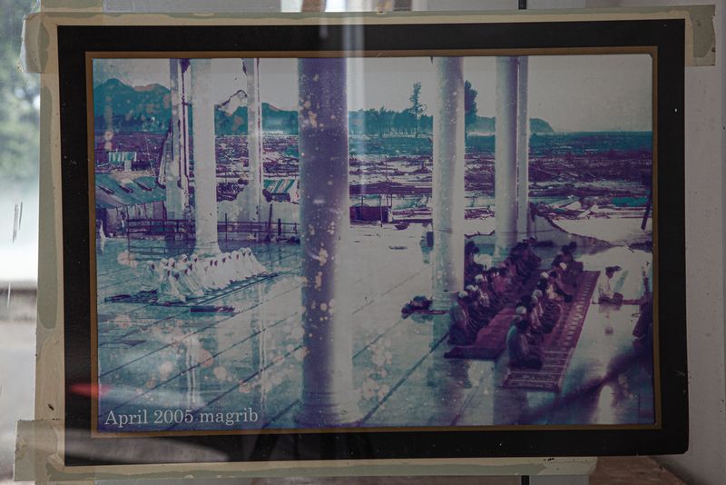 © András Polgár - 10. Archive photo from Rahmatullah Mosque nearly 4 month after the disaster, showing the survivors' evening prayer.