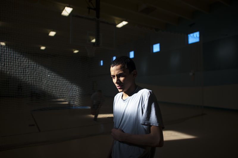 © Isadora Kosofsky. Ramon, age 15, stands in the gym at the juvenile detention center in Albuquerque, New Mexico