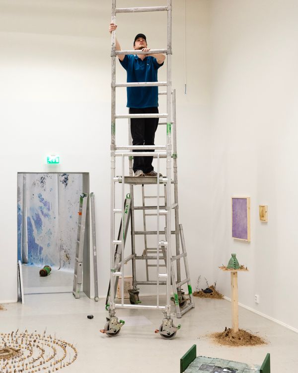 ©Utopias Lahti, Henri Airo building the exhibition "The Apparatus in the Garden"