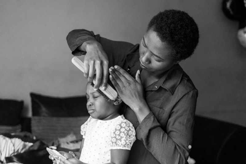 Tayo Brushing Toyosi’s Hair
