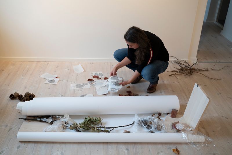 Image of former residency photographer Marta Bogdanska preparing her show.