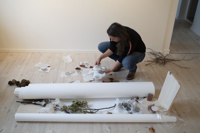 Image of former residency photographer Marta Bogdanska preparing her show.