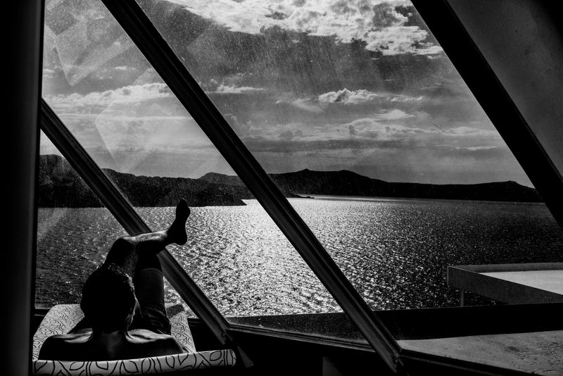 © Simona Bonanno - Passenger relaxing in the spa area while the ship is docked on the Santorini caldera. Cyclades, Greece 2017