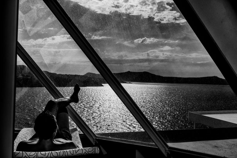 © Simona Bonanno - Passenger relaxing in the spa area while the ship is docked on the Santorini caldera. Cyclades, Greece 2017