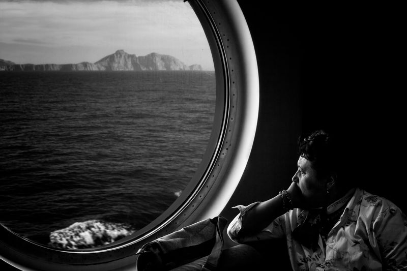 © Simona Bonanno - A woman looking at Balearic Islands Archipelago. At Sea, 2013.