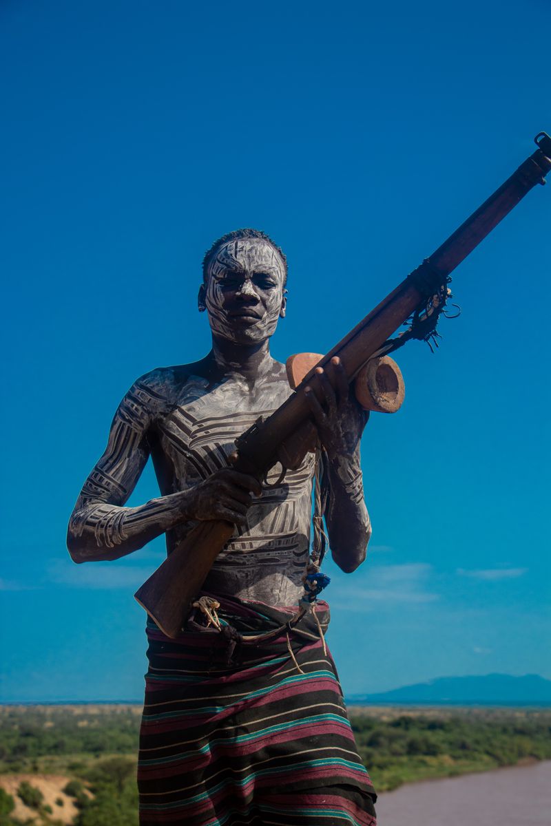 © Nwando Ebeledike - An elder going hunting for the meal of the day, Karo Tribe, Omo Valley, Ethiopia