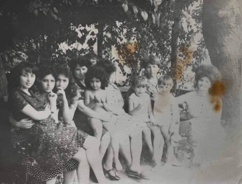 © Natalya Madilyan - An archive photo of the women of my family near our house under the mulberry tree. We continue to be together to this day.