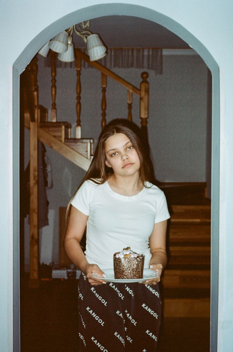 © Natalya Madilyan - Evening at Mom and Grandma's House, Maria is learning to bake Easter cakes.