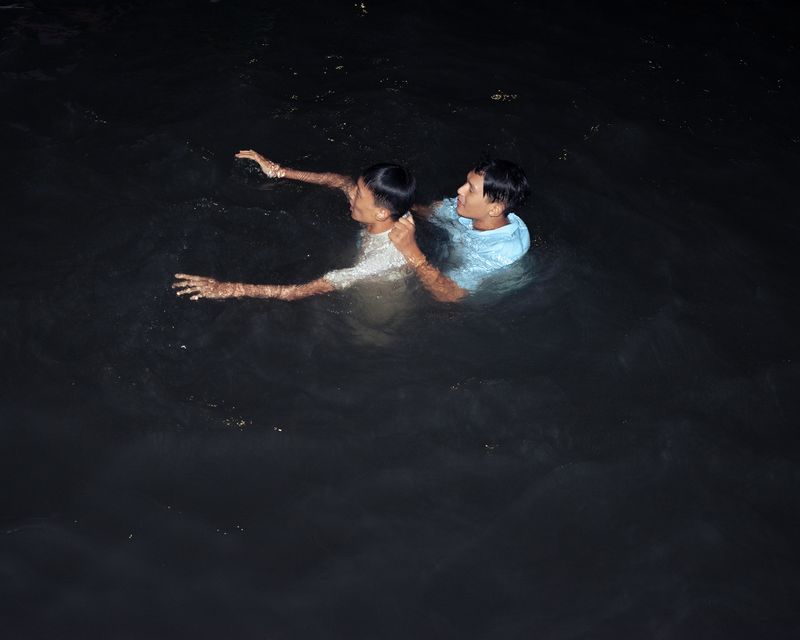 © Arhant Shrestha - One boy teaches another to swim in an ancient reservoir in the medieval-era district of Patan, where I also live.