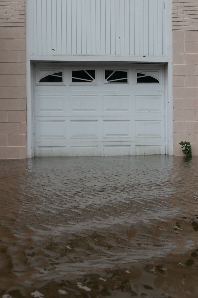 © Angela Ramsey - As the waters rise it seeps into garages and porches throughout the neighborhood.