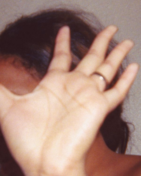 © Odette England - Image from the Woman Wearing Ring Shields Face from Flash photography project