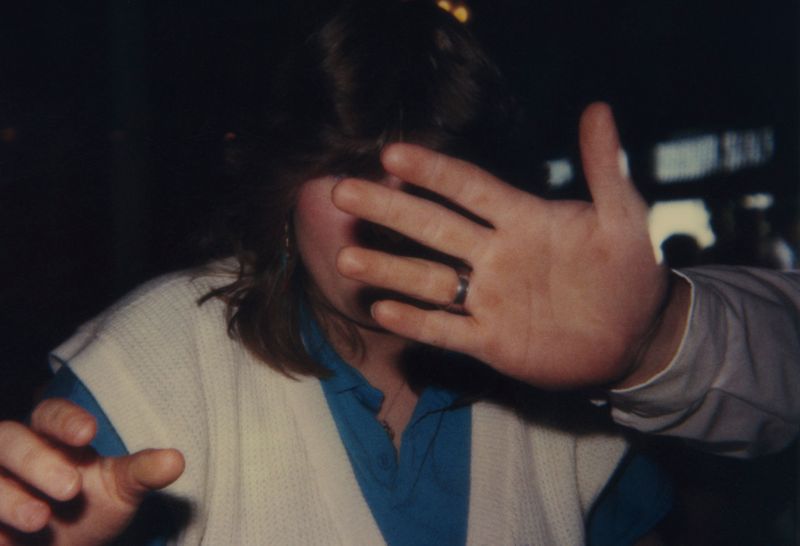 © Odette England - Image from the Woman Wearing Ring Shields Face from Flash photography project