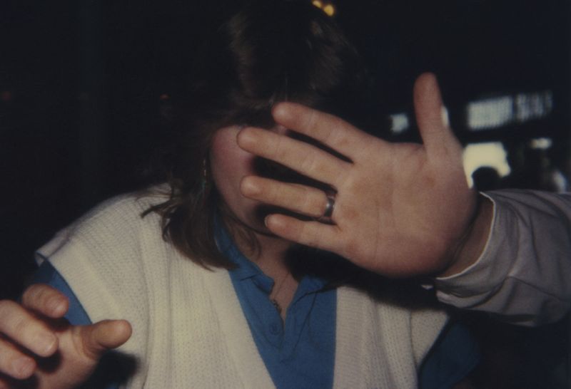 © Odette England - Image from the Woman Wearing Ring Shields Face from Flash photography project