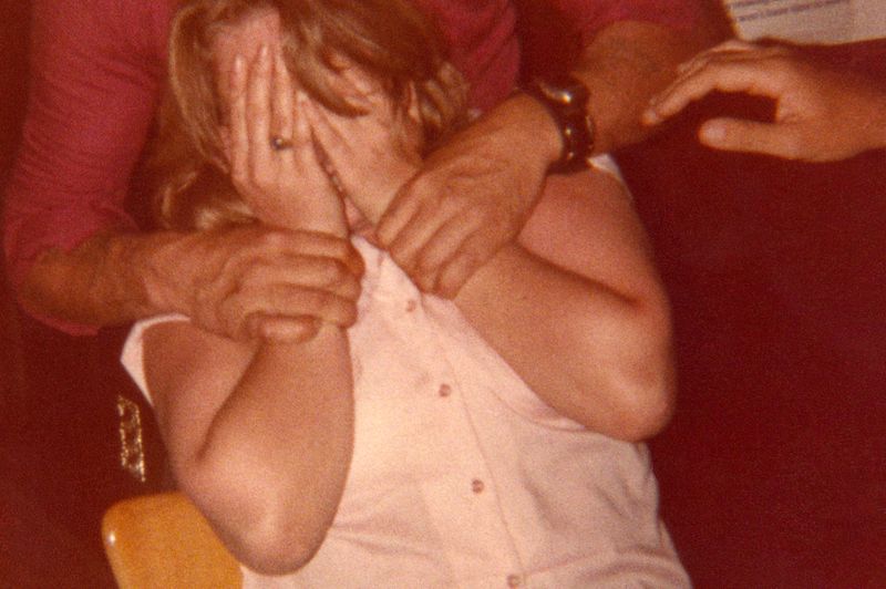 © Odette England - Image from the Woman Wearing Ring Shields Face from Flash photography project