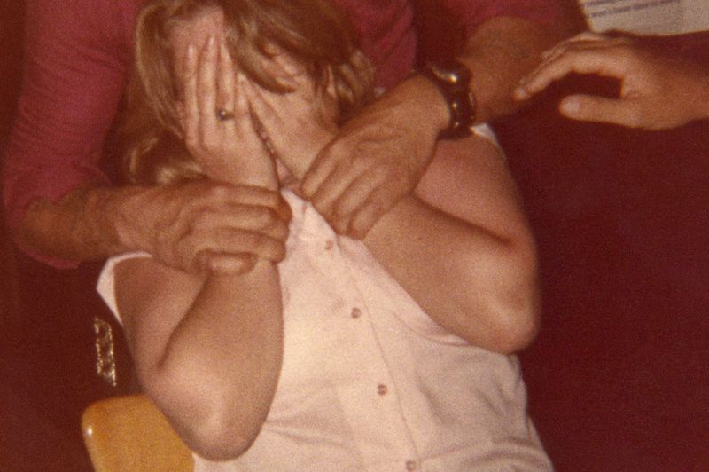 © Odette England - Image from the Woman Wearing Ring Shields Face from Flash photography project