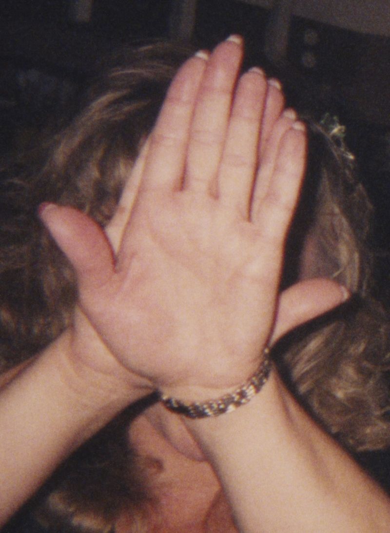 © Odette England - Image from the Woman Wearing Ring Shields Face from Flash photography project