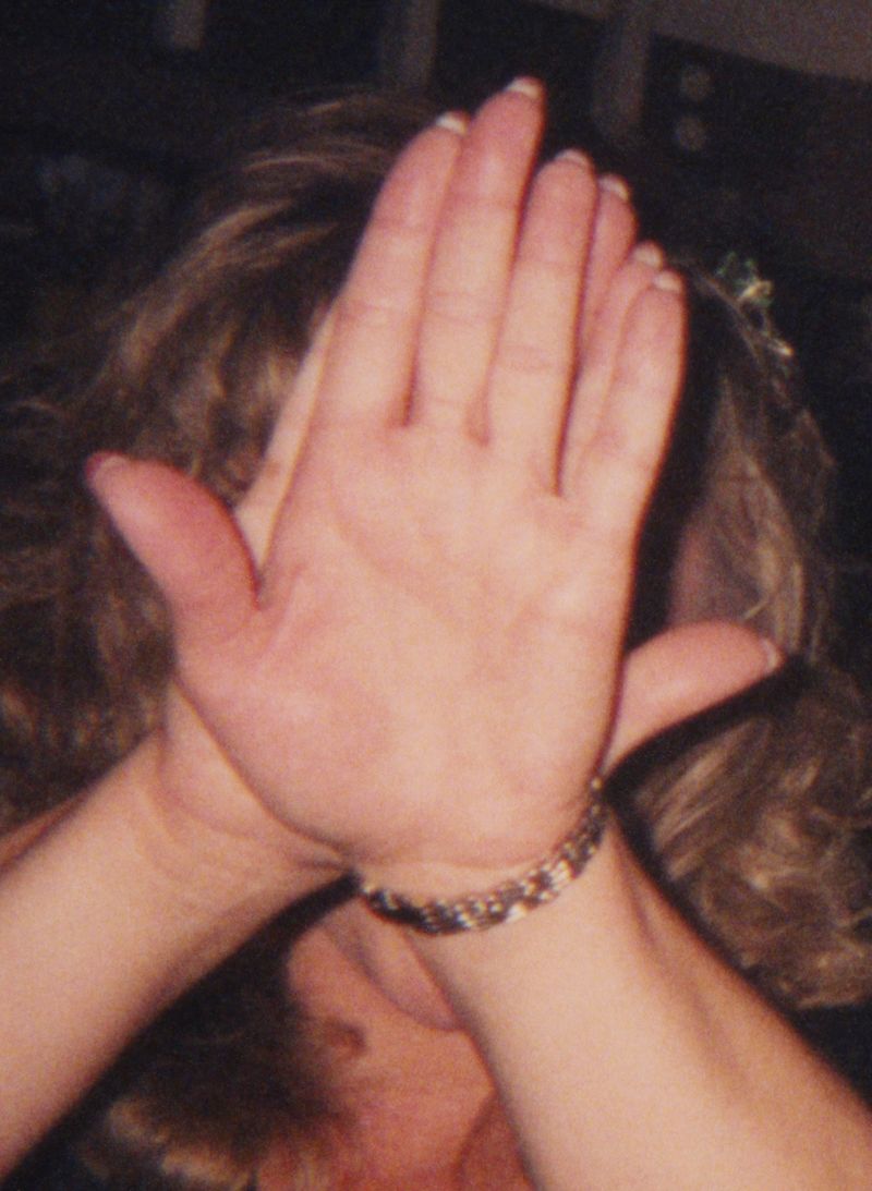 © Odette England - Image from the Woman Wearing Ring Shields Face from Flash photography project