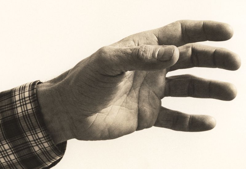 © Odette England - Image from the Woman Wearing Ring Shields Face from Flash photography project