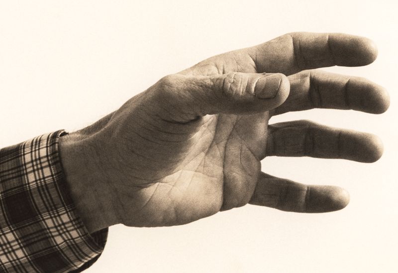 © Odette England - Image from the Woman Wearing Ring Shields Face from Flash photography project