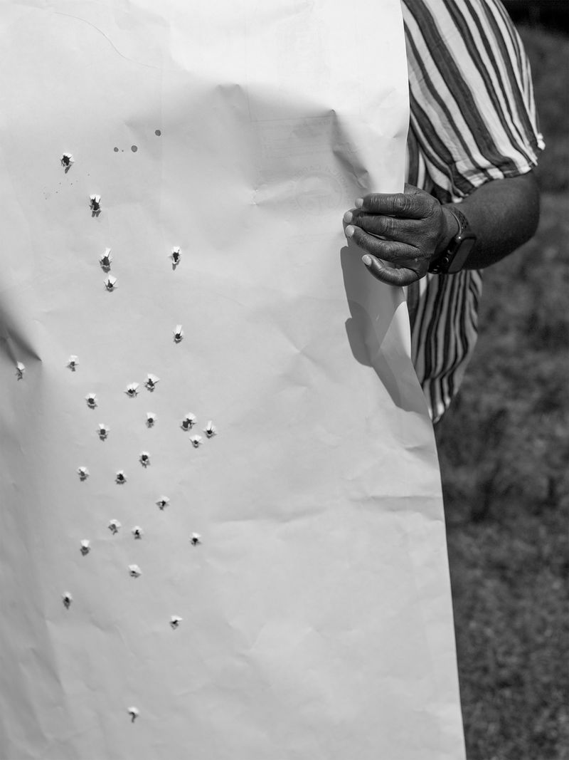 © Odette England - Image from the Woman Wearing Ring Shields Face from Flash photography project