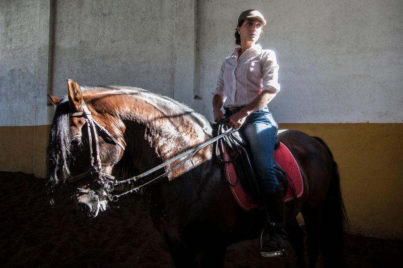 © Chiara Ferronato - Fatima, a professional horse rider, at the ranch were she works whenever her daily duties allow her to.
