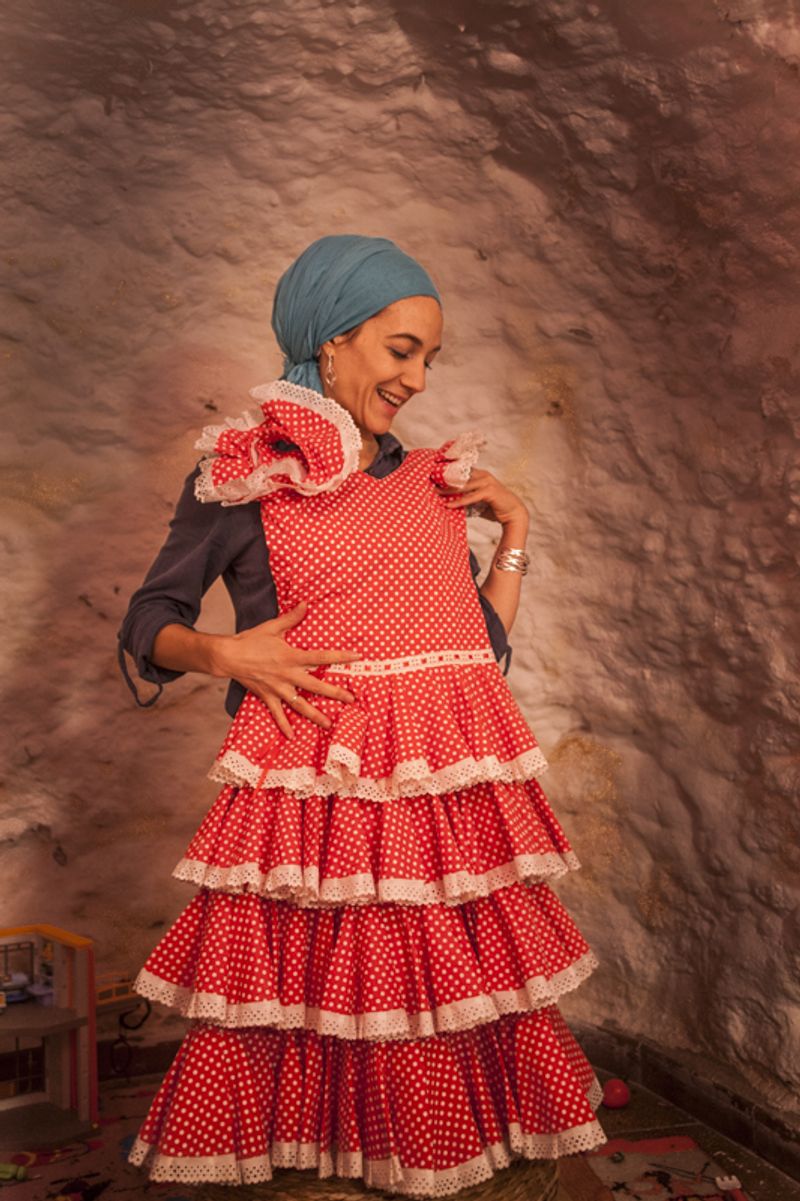 © Chiara Ferronato - Zahara playing with her daughter’s flamenco dress in her parents’ "casa cueva".