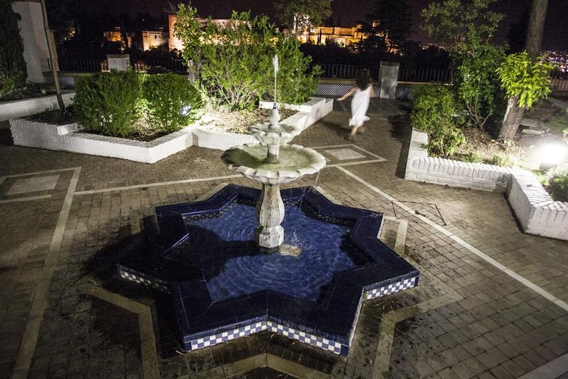 © Chiara Ferronato - A girl running in the courtuyard of Granada’s Major Mosque.