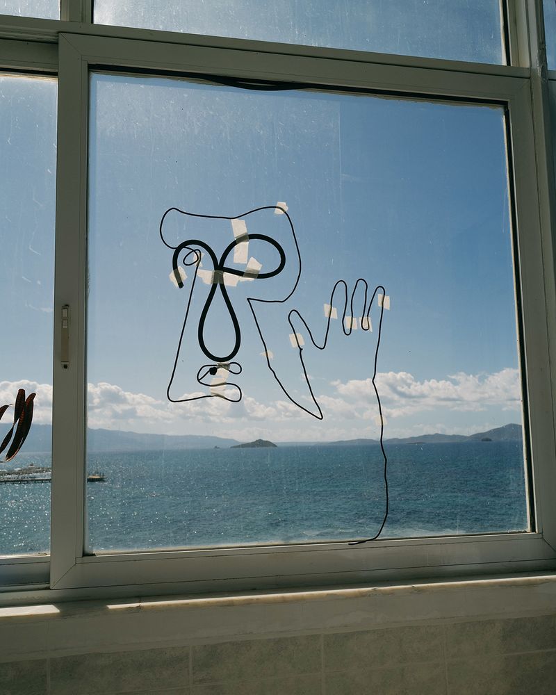 © Nikita Lukyanov - a character on the hotel window