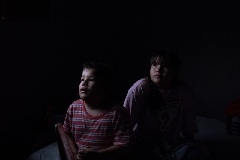 © Frédérique Gélinas - Yair and Ceci watching Chucky the doll on the family's TV.