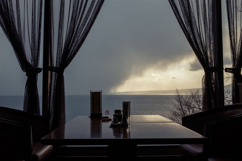 © George Nobechi - Winter Storm at Sunset, Lake Shikotsu