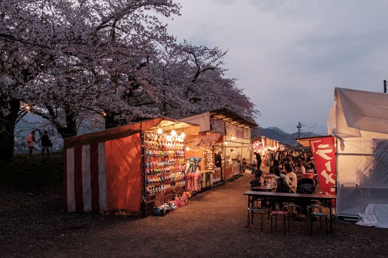 © George Nobechi - Festival Stalls at Twilight