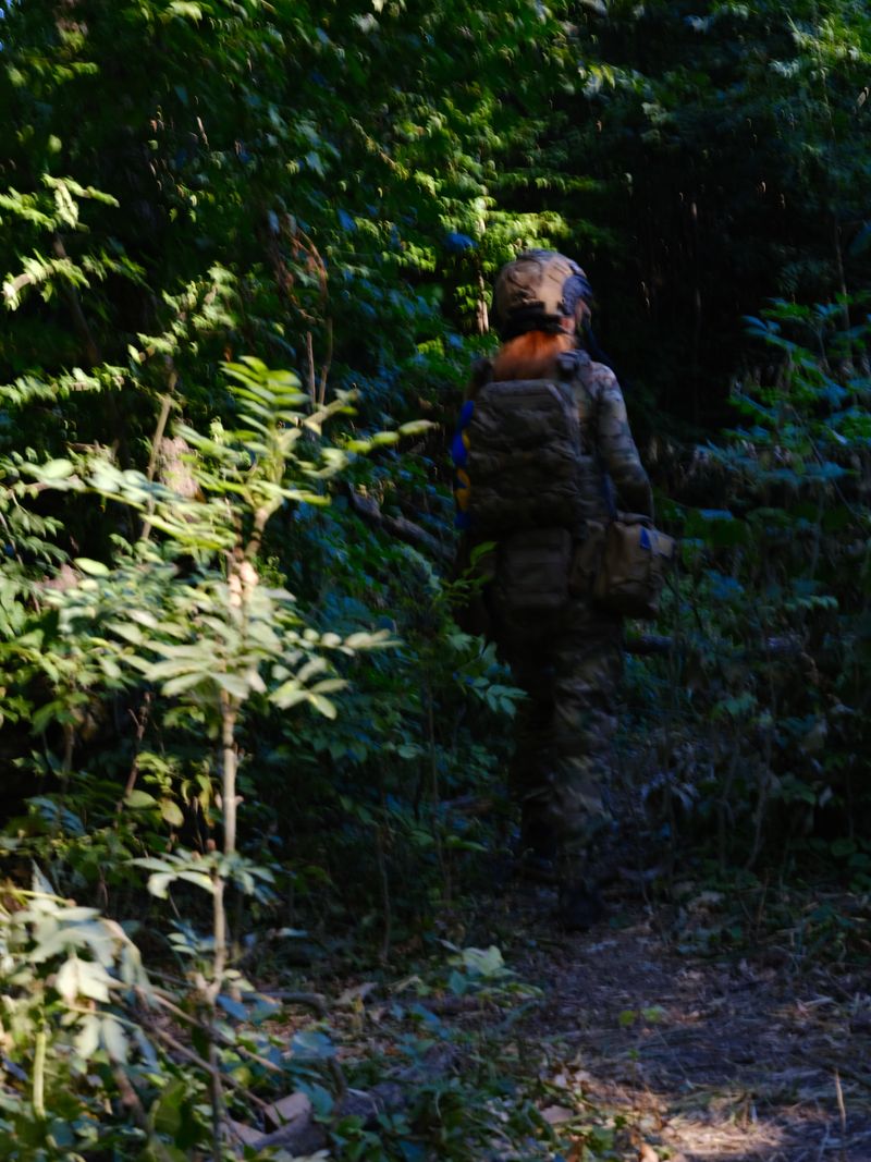 © Marysia Myanovska - Oksana walks through the forest to the position of her unit, Kupyansky direction, August 2024