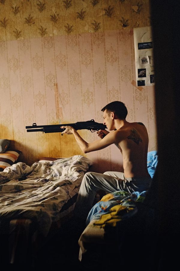 © Marysia Myanovska - Tima with a gun at his placeKyiv, 2019