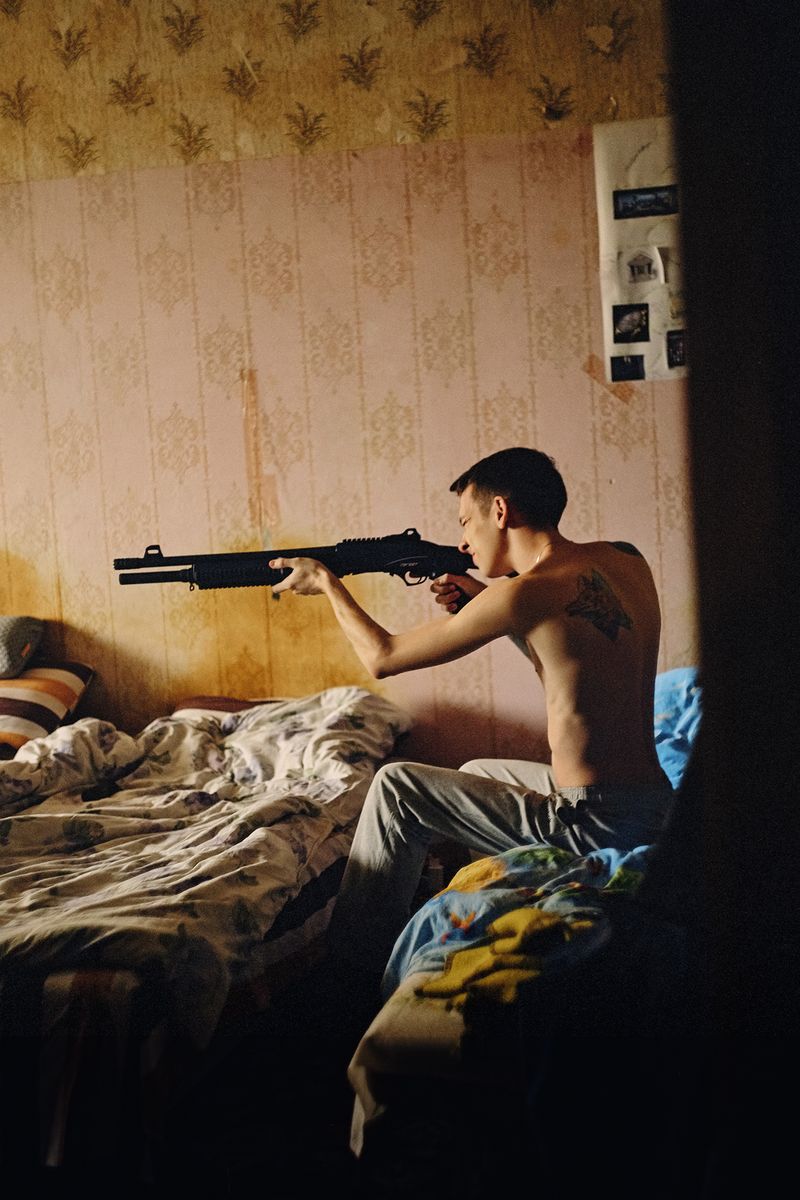 © Marysia Myanovska - Tima with a gun at his placeKyiv, 2019