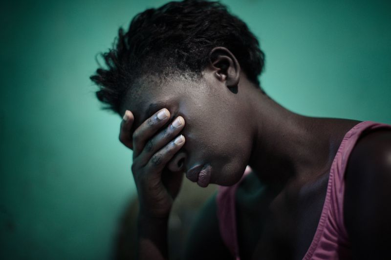 © Carol Allen Storey - Angelique sobs because today her aunt threw her and her baby out, making them homeless.