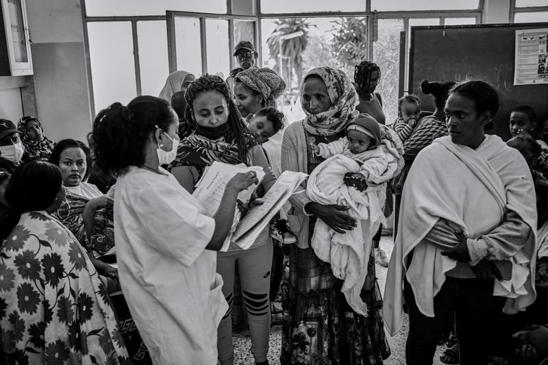 © Carlo Perazzolo - Families with children waits to be called for heart's screening exams in Orotta Hospital (Asmara)