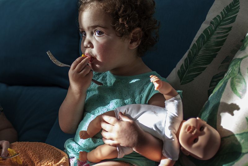 © Séverine Sajous - Zelie and her doll. The idea of ​​motherhood and its role at the societal level has been instilled since childhood
