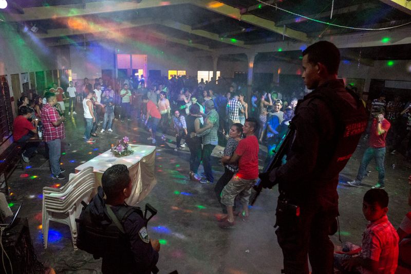 © Francesca Volpi - Police patrolling a beauty event for transvestites, in San Antonio de Cortez, a small village in the north of Honduras.
