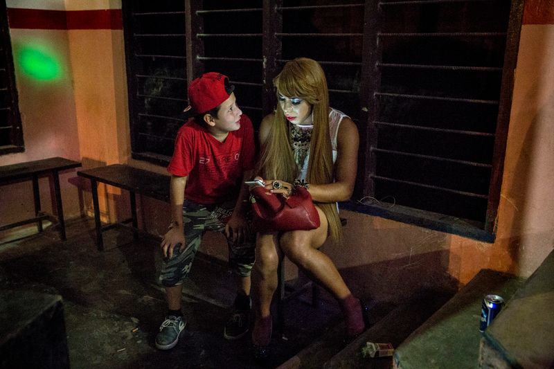 © Francesca Volpi - A young boy approaches Briana asking questions about her apperance.