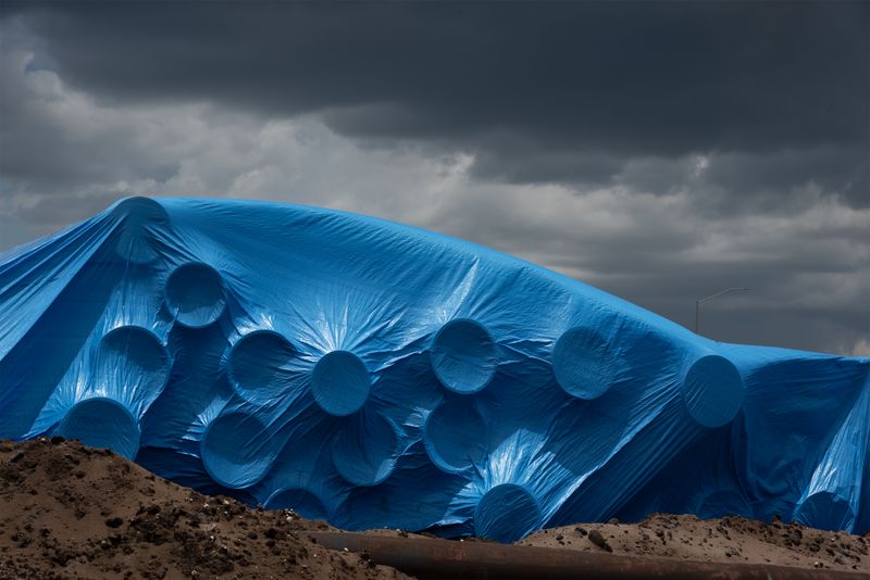 © Steven Benson - Blue tarp to protect water pipes.