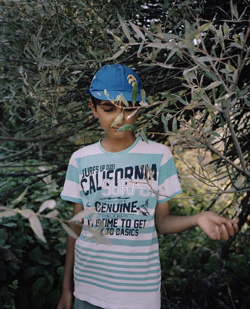 © Miriam Stanke - Little boy taking a rest while supporting his family by taking care of the cows and sheeps