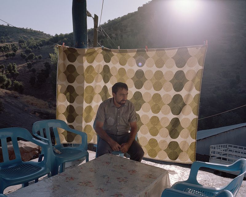 © Miriam Stanke - The mayor of a little village which will be flooded due to the Pembelik dam project, sits in front of his house
