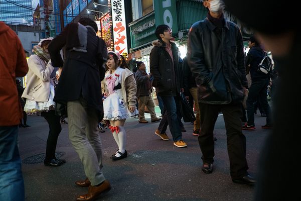 © Isabella Borrelli - A little girl attracts customers to the maid cafe where she works.
