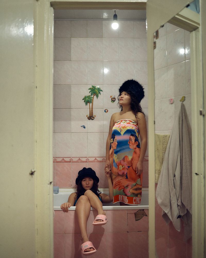 © Louise Amelie - Dreams Behind Doors. The artist Darika Bakeeva and her roommate Dana Fotana in their apartment in Bishkek
