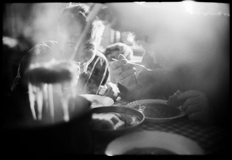 © Jost Franko - Shepherds eating a meal in the morning, after goading the cattle from the valley to the mountains for the whole night.