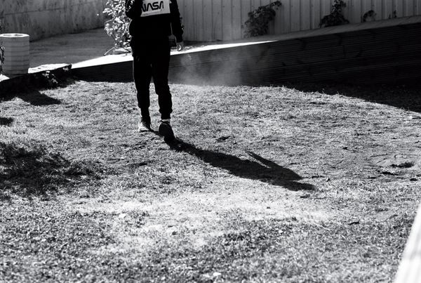 © Ksenia Shupenya - Movement caught in stillness - a figure, a shadow, suspended mid-step. Ilford Delta 100