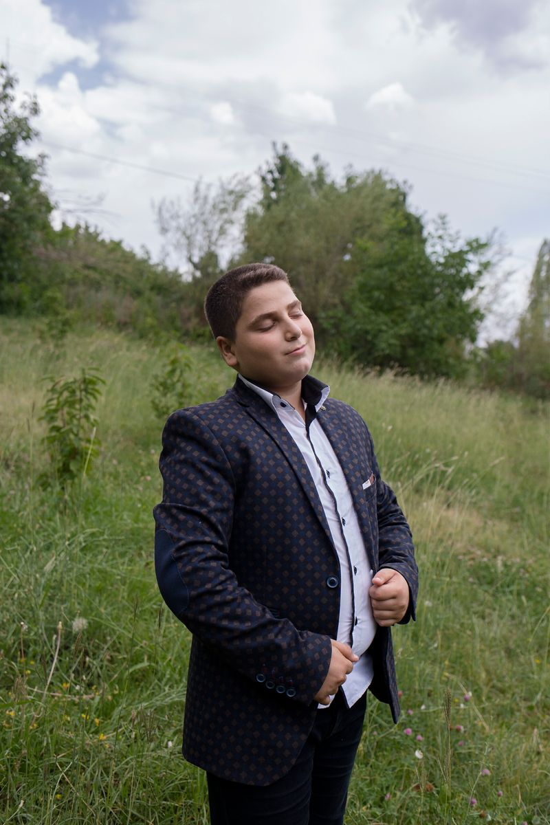 © Parisa Azadi - AUGUST 4, 2018 - Milad Ebrahimi stands for a portrait during his cousin’s engagement party in the village of Alamut, Iran.