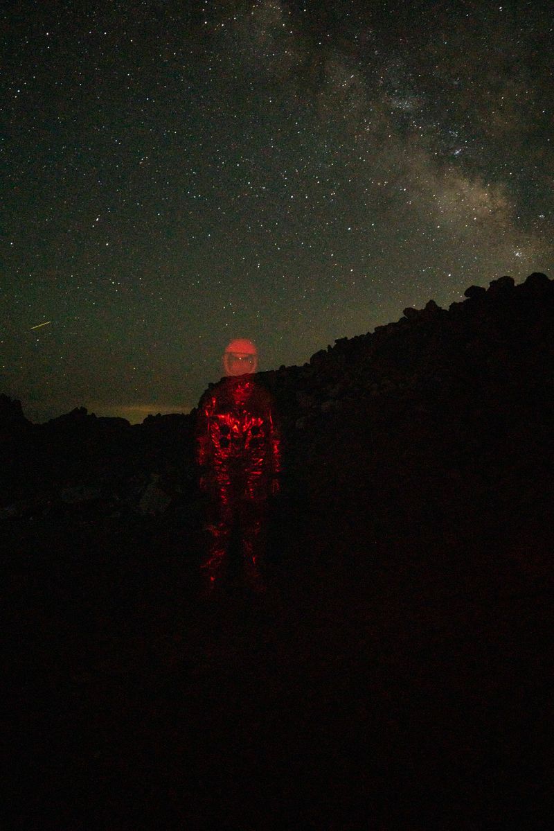 © Mackenzie Calle - A queer person, semi-erased from the world while in an astronaut suit.