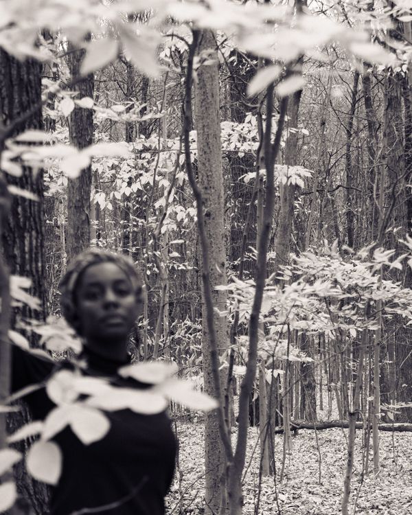 © Eleonore Menga - Black woman emerges amongst the depths of the woodland, Montreal 2023