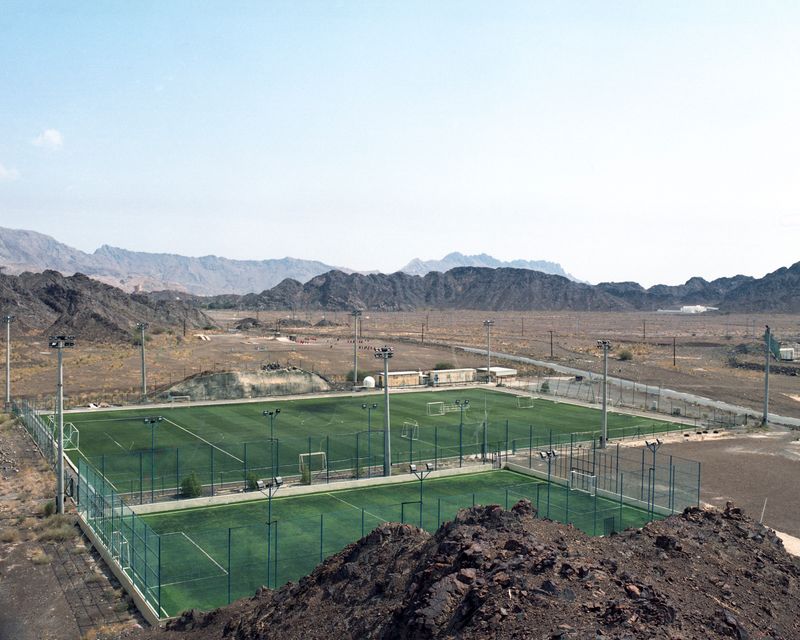 © VALENTIN JOSEPH VALETTE - A new soccer field was built on the outskirts of the city and surrounded by mountains. Nizwa, October 2021.